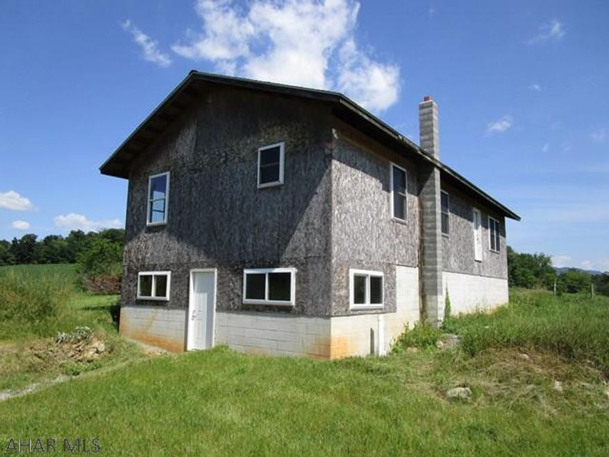 The property consists of 2.24 acres with nice country views!  There is a home that was started in 2005 that is currently a shell and could be finished.  Drilled well on site, septic system and electric.  Basement has concrete floor with radiant piping for heat, wood stove hook-up and thermo pane windows.  21'x 32' two-car detached garage, 18'x 24' pole barn and some high tensile fencing.  Property is conveniently located in a rural setting but close to all amenities.  Finish this house the way you want and make it a home!!