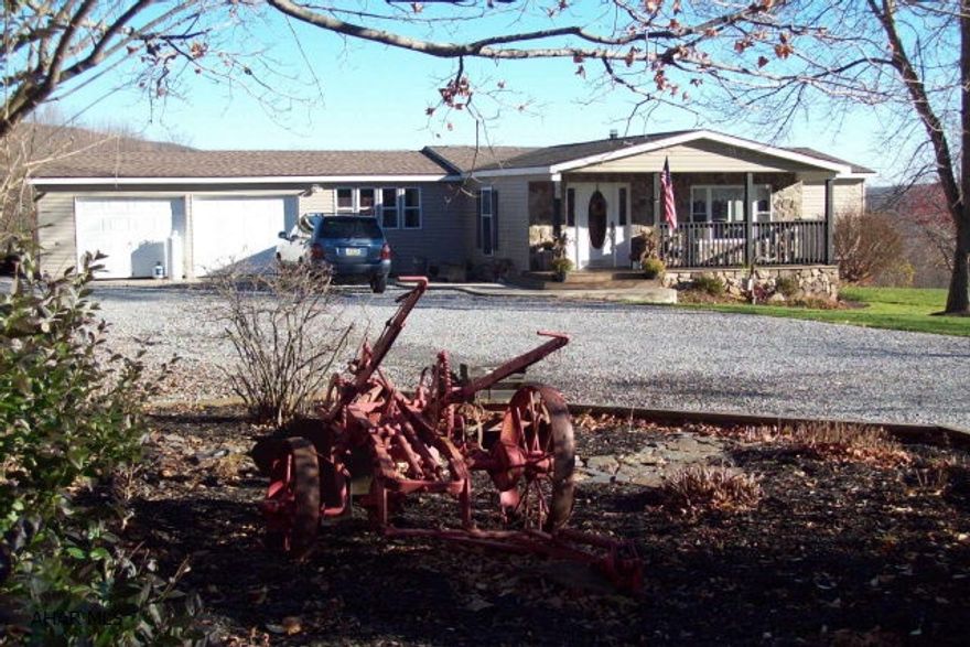 Renovated 4-bedroom ranch home w/2 full baths, p-bsmt w/family room, storage area & outside entrance. Include a 20' x 30' barn w/ attached 30'x32' workshop, fenced for horses, underground fence, fruit trees & bushes and raised garden & herb beds. This property also includes a Home Warranty and Money Back Guarantee.