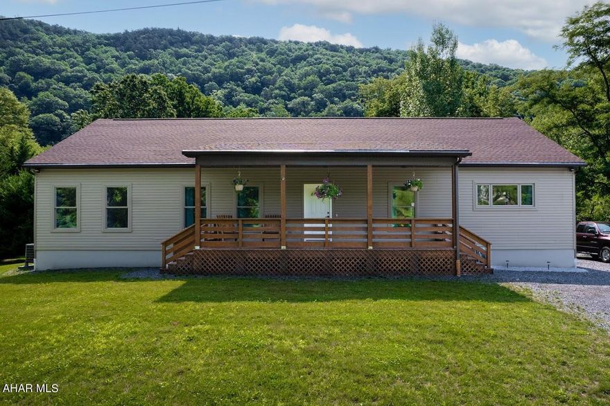 This waterfront home nestled in the Appalachian Mountains of Central Pennsylvania is located along the Raystown Branch of the Juniata River. Just a few miles down river is the start of Raystown Lake which abounds with recreational opportunities including boating, hiking, camping, and world class fishing...not to mention fishing, swimming, and kayaking opportunities in your own back yard! This modern ranch home was just built in 2021 on 2 acres. Plenty of views of the river and mountains throughout the home. Open floor plan with 9-foot ceilings. The large kitchen has plenty of cabinetry with under counter lighting, plus a pantry that provides plenty of storage, a large island with stools included, and stainless-steel appliances. The spacious master suite includes a walk-in closet and a master bath with a walk-in ceramic tile shower, water closet and dual sinks. Main floor laundry room includes utility sink and ample storage. Full unfinished walkout basement can be finished to suit your needs. The 2-car detached garage has a heat pump with electric back-up furnace so you stay warm in the winter and cool in the summer. In addition to Raystown Lake and the river / mountains at your home, numerous other recreational opportunities are located near this home including state game lands, trout fishing streams, and the Huntingdon and Broad Top Rails to Trails which is located just across the river from your new home.
