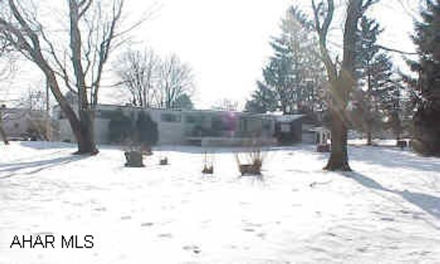 3 bedroom mobile home on a beautiful large lot in a great area of Bellwood.  Covered porch - 1 1/2 car garage - Don't let the cats out.