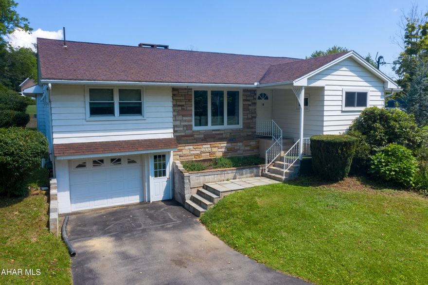 Beautifully kept 3 bedroom, 2 1/2 bath ranch home sitting on approx 1.03 acres with amazing mountainside views! This home features new luxury vinyl plank  flooring in kitchen and half bath, original hardwood floors  in bedrooms, gas fireplace in spacious living room, and large bedrooms! The larger master suite offers plenty of closet space, a jacuzzi tub in master bath and a patio overlooking the back yard. Enjoy entertaining in the sunroom right off the kitchen! There is plenty of parking with a paved U shaped driveway! The lower level is partially finished with kitchenette area and additional room for storage!