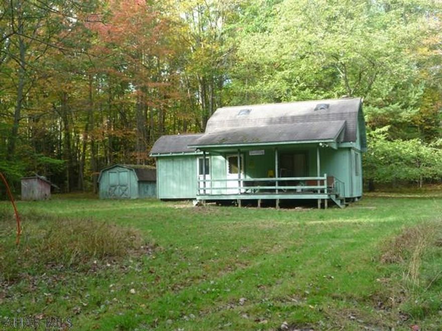 Private camp where you can get ready for the hunt or just relax with friends and family.  Cabin with kitchen / living room and bath on first floor.  Second floor is an open bedroom area.  Set on approximately two mostly wooded acres.  There is a well but city water is available to connect to as the tap has been paid.  Septic tank.  Electricity.  Heat is electric hot air along with a combination wood and coal stove.  The comforts of home while camping in the woods.  Approximately 8 miles from Prince Gallitzin State Park / Glendale Lake, State Gamelands 108.