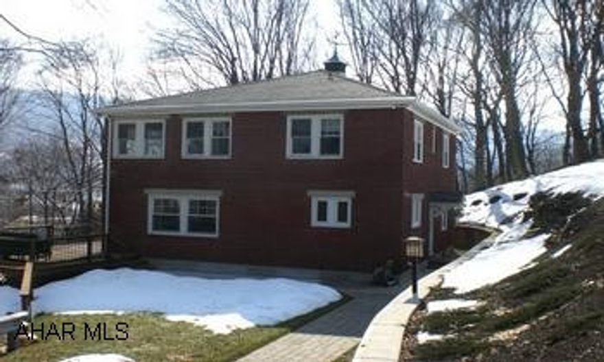 Elegant brick home nestled in Juliana Heights w/ absolutely gorgeous views. Paver driveway and 1 car detached garage. Stellar quality home on Juliana Street w/ privacy. Elegant brick home nestled in Juliana Heights w/ absolutely gorgeous views. Paver driveway and 1 car detached garage. Home offers a kitchen w/ top-tier built-in appliances, quartz counter tops, ceramic tile floor w/ radiant heat, a den w/ built-in mini refrigerator, built-in book cabinets w/ glass fronts, hardwood floors, a LR w/ gas log f/p, open wall DR w/ hardwood floors, a MBR suite w/ sitting window. MBA has ceramic tile floors and walls, claw foot tub, ceramic tile walk-in shower w/ glass door. Stellar quality home w/ privacy!