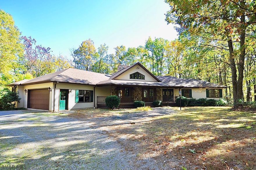 WOW! This sprawling ranch style home is hidden away at the end of a long, meandering private driveway in Tyrone Township, Blair County, just south of Tipton, home of Delgrosso's Amusement Park! One of a kind and custom built, it is surrounded by nearly 305.2 wooded acres! Room to live, roam, hunt, and never be found if you don't want to be. Quality custom construction, soaring ceilings, 2 massive stone fireplaces, glowing hardwood floors, a kitchen big enough to feed an army, and stunning views to the north of Tipton, DelGrossos and I99 from the hidden lookout at the top of the ridge. This unique property can not be described in words. This will not last.