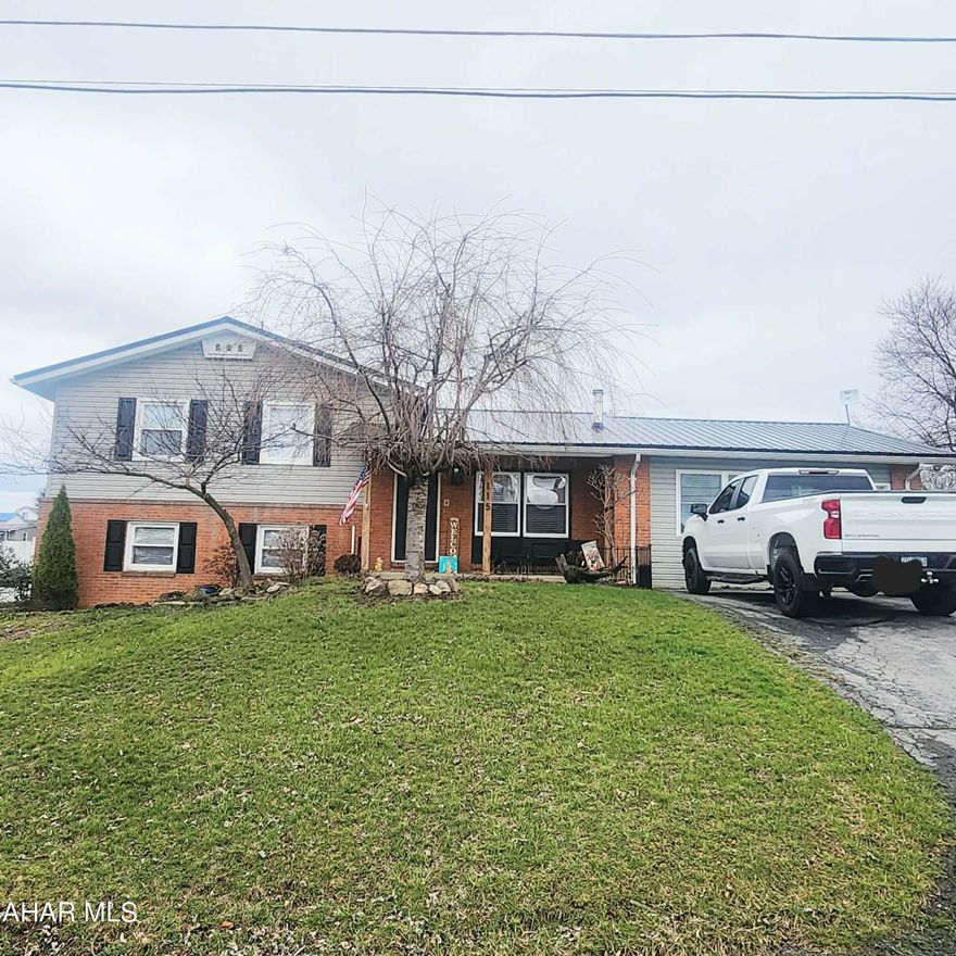 Welcome to 115 N Ann Street, Martinsburg. This property has been nicely updated and is ready for a new owner. The main level offers a beautiful kitchen with island, dining room, walk-in pantry, living room with a half bathroom, and a den leading to the back patio. The upper level offers a full bathroom, primary bedroom, and additional bedroom. The primary bedroom has plenty of room with a fireplace and a large walk-in closet. The lower level offers a bathroom, two bedrooms, and laundry. Outside the backyard has a large fenced area for any activity. The one bay garage is great for additional storage. The pool is a saltwater pool with a newer liner and is perfect for cooling off on hot summer days. Located in Martinsburg borough, this home has so much close by for dining and activities. Call listing agent for your tour.