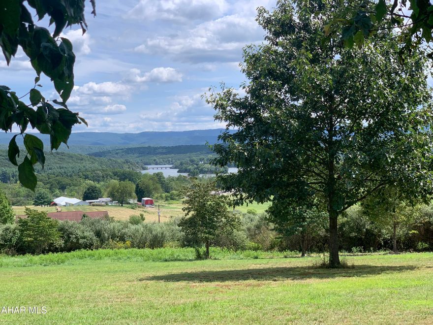 Get ready to be WOWED!! 27 acres ready for you to call home.  Land has a private well and ready for public sewer hookup. Sewage planning module is completed and approved.  Power available with buried electrical conduit installed from the Penn Electric pole site to the planned transformer site. Approximate 7-8 acres of open pasture, balance of land in mature hardwood forest.  Garden plot established with apple, peach, and cherry trees.  Elderberries and fig plants producing fruit.  Check out those views!!! Can you imagine seeing Shawnee Lake out your front windows of your next house? Get ready to build today!!