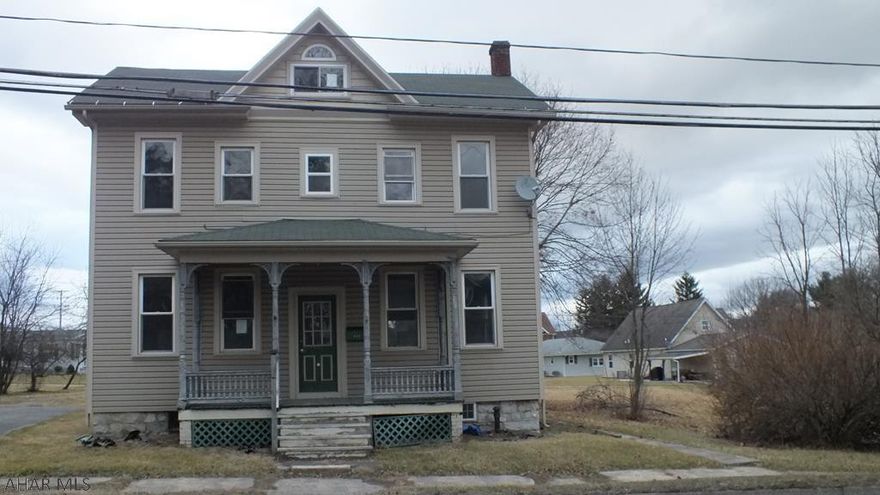 Martinsburg Borough vinyl 2 Story. Home needs some TLC, but  loads of possibilities in great area. Large living room, formal dining, oak kitchen. Nice, level lot. Check it out! AS-IS sale. Seller will make no repairs.