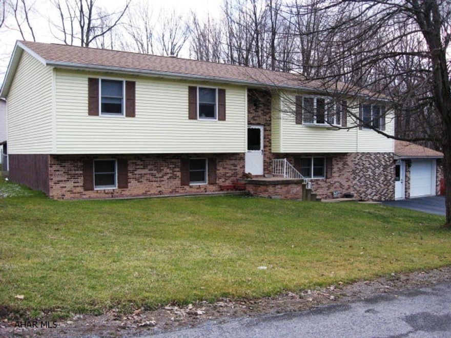 Oversized 4 bed, 2 bath bi-level on a quiet dead end street. Spacious kitchen with breakfast bar and informal dining rm. Large lower level with multi-rms. Oversized 1 car garage with loft storage.  Private wooded lot. New OHW 2 zoned heat w/central air. Additional lot included (across the street) 42x124.  Fenced yard. Logan Twp.