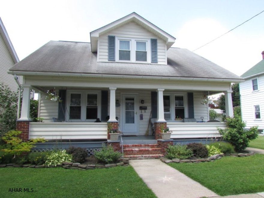 Lots of new inside and out! NEW kitchen, bath, gas furnace, windows, doors, plumbing, attic insulation, fence and landscaping, plus a new coat of paint inside. Hardwood floors. Quiet neighborhood. Great outside living spaces with a 7x30 front porch and nicely landscaped back yard with privacy fence. One-car garage plus off-street parking for another vehicle. Low utilities with the new gas furnace and updates.  Don't miss this one!