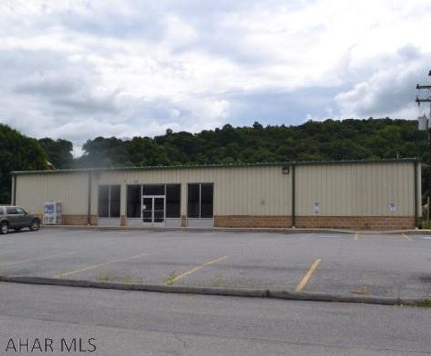 Commercial Building for sale or lease in the heart of Williamsburg. 7000 square feet, 21 parking spaces, great mechanics. The foundation is reinforced cinder block walls with reinforced concrete floor. Exterior is structural sttel-Nucore metal building. Most ceilings are 10 feet. Storage room ceiling is higher. For sale or lease.