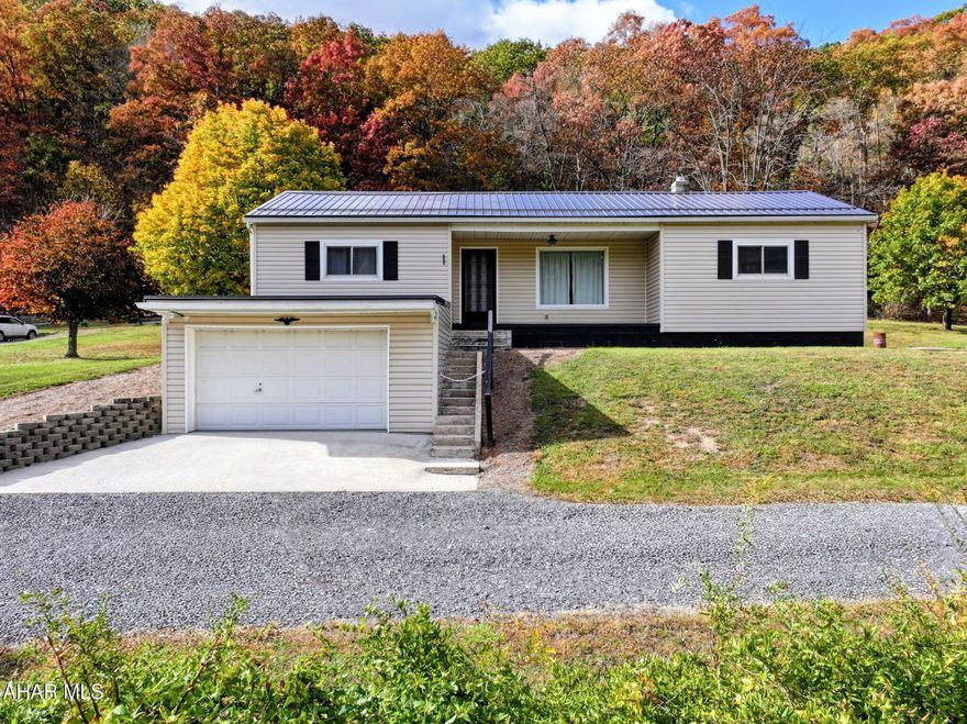 Experience stunning mountain views from this beautifully remodeled home.  Move in ready with recently updated siding, roof, bathrooms, flooring, and more. The home features modern updates throughout while maintaining its warm, inviting charm.  The finished basement can be used as a game room, movie room, additional bedroom or living room.  Basement is complete with smart technology lights, new half bath, propane fireplace, storage area and more. Enjoy both comfort and functionality with a spacious 3 car detached garage and an attached integral 2 car garage.  Perfect for vehicle, hobbies, or additional storage. Did we mention the 2 additional sheds for storage! So much potential with this beautiful home.