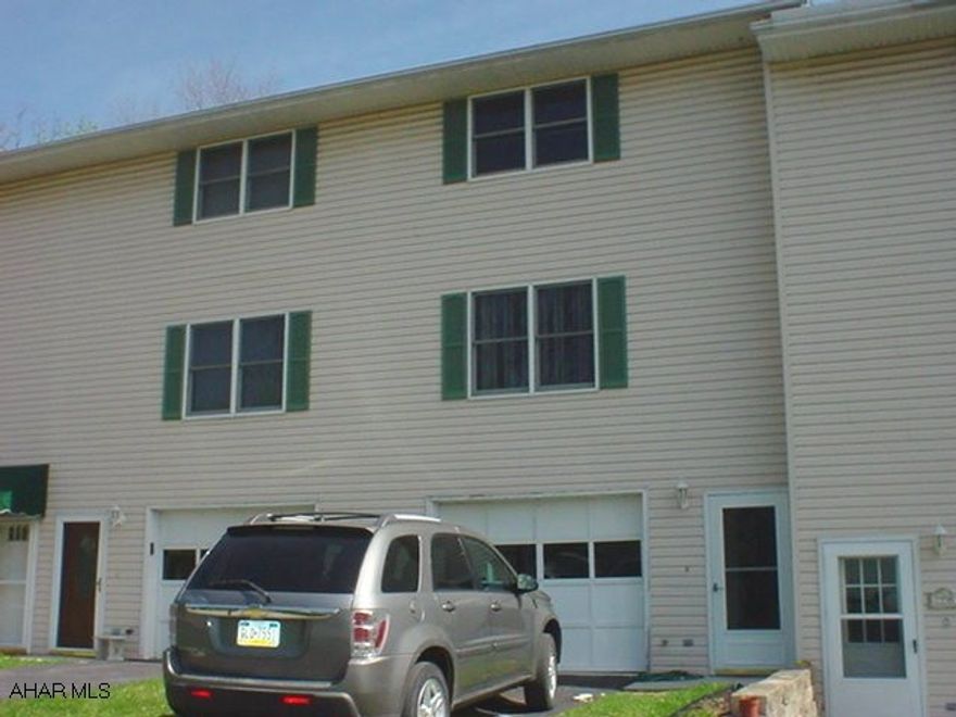 Great 2 bedroom townhome on Hopewell Drive with 1 car garage. New laminate floors, large bedrooms, vinyl exterior, nice rear deck, close to park. All appliances included. Private setting. Just move right in!