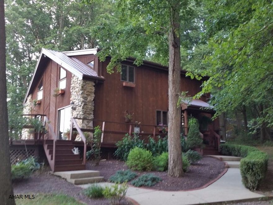 Beautiful tongue and groove woodwork. Great views, 9.83 acres! Nice deck, wooded setting behind home, 3 out building including garage, 2 story kennel with heat and air, 18 x 12 pole building and 11.5 x 13 shed. Seller prefers 60 day closing.  #J-307