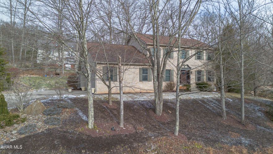 Pull into the spacious driveway at 234 Woodlawn Terrace and it immediately feels right. An attached two-car garage, a welcoming front entry, and a layout that makes sense from the moment you step inside. The foyer opens with the staircase ahead, a formal living space to the right, and a dining room that flows easily into the kitchen. To the left, a first-floor office and half bath add everyday flexibility. The heart of the home sits just beyond with an inviting kitchen that connects to a relaxed living area with a stone accent wall and gas fireplace. From the kitchen, you step out to a covered back deck that leads to the pergola, fire pit, and newly added shed—made for relaxing or hosting friends.Upstairs offers three generously sized bedrooms, including a primary suite with two walk-in closets and a private bath with a jetted tub. The lower level is thoughtfully prepared for future finishing, featuring a media room, flex space, plumbing for a bath, Drylok-treated walls, and dual French drains. All of this, set in the heart of Hollidaysburg, in one of its most sought-after neighborhoods.