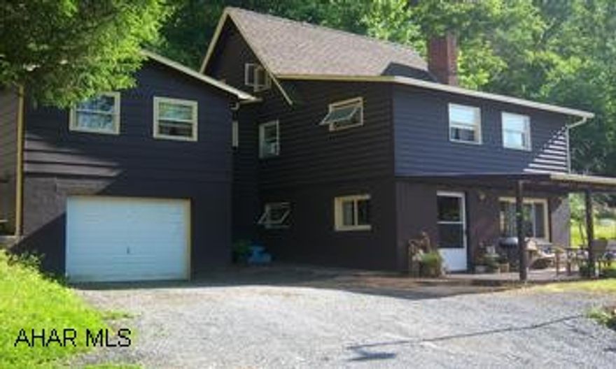 charming log sided two storyhome in a private setting overlooking  the Juniata river but not in a flood zone. This home features 4 bedrooms, 2 bath an oak kitchen, stone fireplace, upstairs laundry, master bath with whirltub, and a one car attached garage Charming log sided two story home in a private country setting overlooking the Juniata River, but not in a flood zone. This home features 4 bedrooms and 2 full baths, oak kitchen, stone fireplace, upstairs laundry, master bath with jacuzzi tub, new carpet, newer roof, large covered porch and a attached one car garage. Kitchen appliances are included. Conveniently located close to town. Well kept and ready to move into or use as a summer getaway.