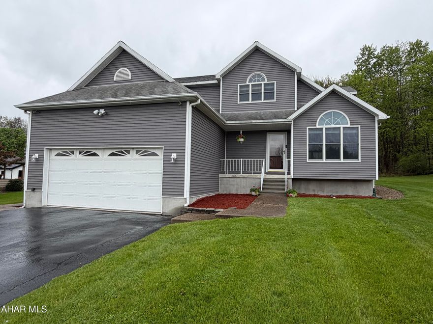 No need to look any further, you can simply pack your stuff and move into this beautiful 3 bedroom, 2 full, 2 half bath home.  You will love the peace and privacy this home offers on this quiet Altoona street.  Enjoy the multiple areas to relax inside such as the living room with a vaulted ceiling and tons of natural light, the family room next to the eat-in kitchen or the downstairs entertainment area. The convenience of the second floor laundry right outside the master en-suite is another reason you will want this home to be YOUR home.  For those times you want to be relaxing outdoors just hop into your own heated inground pool surrounded by a concrete patio and cozy gazebo. Other pluses include the oversized two car garage with access to basement, main floor of house or the backyard. The finished basement with a family room, office and storage add to the list of what will make you fall in love with your next home.