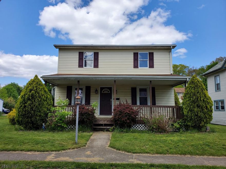 3 bedroom 1 bath home located on a quiet street within walking distance to the school. This home features spacious bedrooms, 1st floor laundry, front and back covered porches and a garage with a half bath.  With a little TLC this would make a perfect place to call home.