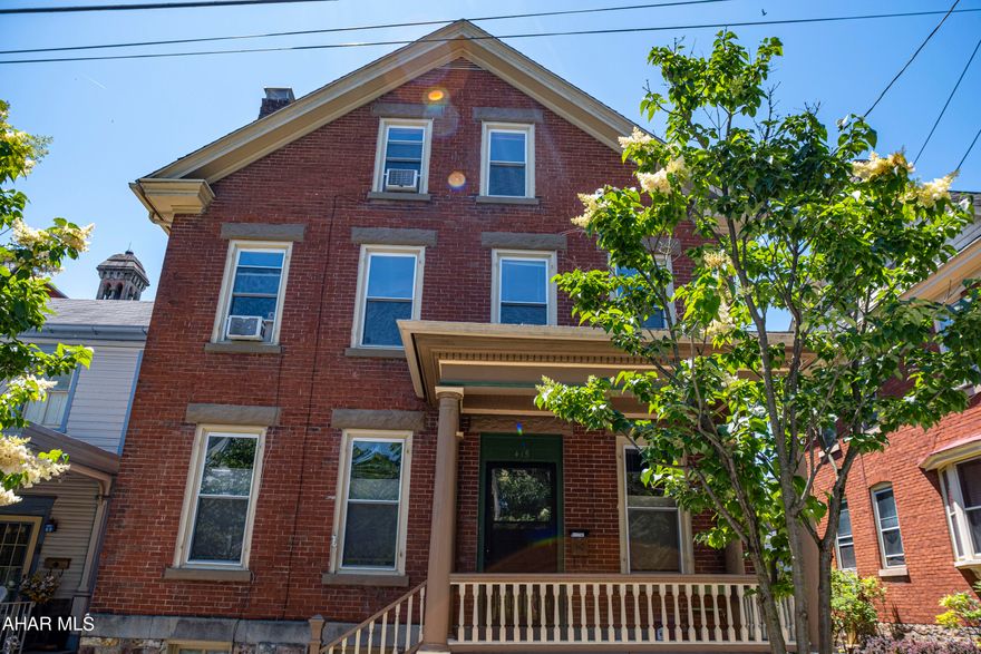Looking for a home truly in the heart of Hollidaysburg? Here it is! This two-story, charmer was built around 1915 and has been well maintained over the years. Just steps away from the Blair County Courthouse, the most popular restaurants & stores in the Diamond of Hollidaysburg-this home is more than conveniently located. With three bedrooms on the second floor, a full bathroom, and a primary suite on the third floor-including an ensuite bathroom, the possibilities of making this home yours is endless. The large backyard features a concrete pad for basketball or other activities, a space for a garden, and fresh professional landscaping. Step out on the front porch for morning coffee, or to watch the local parades go by! Just walking distance to the local schools, sports stadium, and YMCA, is perfect for fall walks to the football games and other local attractions. Call for a tour today!