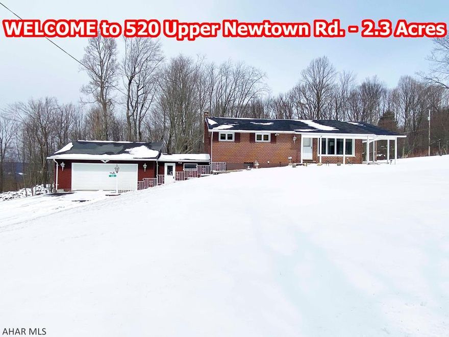 Well maintained quality 3 Bedroom brick ranch-built & enjoyed by 1 owner. The Living Room has carpet over hardwood. Nice eat-in Kitchen with newer flooring includes the appliances & provides access to a large covered side porch where you can sit and enjoy the beautiful setting! Hardwood floors & double closets in Bedrooms 2 & 3. The Master Bedroom has a HW floor & a half bath with a closet. The main bath has newer flooring & a newer vanity. The lower level has a Rec Room with bar, a 1/2 bath, a walk-in shower and large Laundry/Utility Room. Hot water heat PLUS central air! A breezeway connects the Lower Level to the 2 car Garage with automatic opener. Enjoy the 2.3 acres with 2 sheds, a grape arbor, and stone wall! Great property!