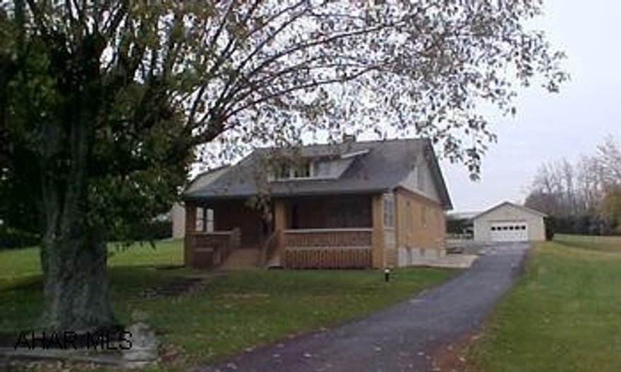 Taylor Twp.  Rt 36S from Roaring Spring to yellow lite, Right on Closson Road, Right onto Cabbage Creek, 5th on Left.  Nice Brick Cape Cod.  Natural wood work, hardwood floors, newer oversized heated 2-story 3-Bay garage (32x48) plus 1 car garage.  #J-851 Taylor Twp.  Rt 36S from Roaring Spring to yellow lite, Right on Closson Road, Right onto Cabbage Creek, 5th on Left.  Nice Brick Cape Cod.  Natural wood work, hardwood floors, newer oversized heated 2-story 3-Bay garage (32x48) plus 1 car garage.  #J-851