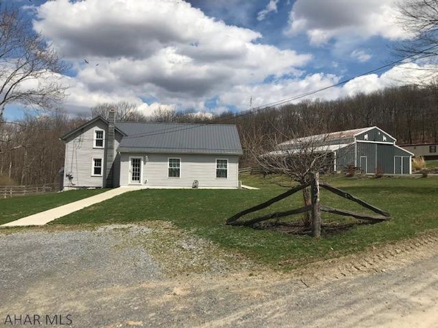 Lovely 3 BR 1-1/2 bath home at the end of a private lane with lots to offer.  Completely remodeled in 2012 this home features an updated kitchen,  a large family room with vaulted and beamed ceilings and lots of rustic touches.  Glass French doors lead to a patio that overlooks the fenced horse pastures.  Speaking of horses, check out the 8 stall horse barn complete with tack room and workshop... this is a horse lovers dream!