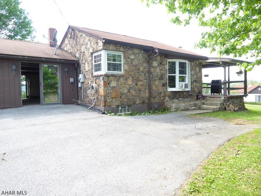 First floor living at its best. This home offers original features and unique character.  The original built-ins, hard wood floors, stone accents, and even corner windows give this home a unique character.  The mud room has stone fireplace and an exit out to the back yard.  The garage has a workshop in the back.  It comes with a shed, chicken coop, and raised garden area. It offers a great outdoor space.  Enjoy sitting on the front porch or gardening in back yard or maybe just enjoy the views from the back yard.  With the character of this home plus a little TLC, it will be a great forever home, starter home or retirement home.