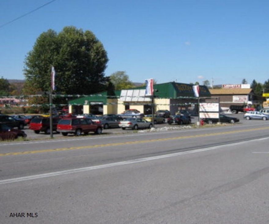 Buzzy's Garage - Newly Remodeled Building that includes a showroom and repair garage. Paved Lot. Solar Panel