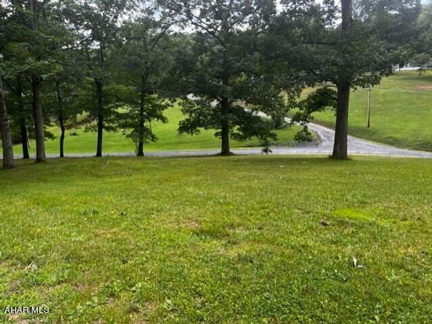 Check out this 2.44 acres of prime real estate in the charming area of Hopewell, Pennsylvania.  It comes equipped with a well and septic, and the lot is cleared and ready for you to build your dream home. You'll have plenty of space to stretch out and enjoy the great outdoors. 

Overall, this property is a one-of-a-kind opportunity to escape the hustle and bustle  and embrace the serene countryside. Whether you're looking to build a cabin in the woods, a sprawling estate, or anything in between, this property has got you covered.

Small easement at bottom of driveway shared by neighbor for access to the neighbor's wooded ground.  There is a concrete pad that a prior doublewide sat on. Electric ran to property and concrete driveway.

Well and septic were functioning when prior home was there.  Property being sold as is.