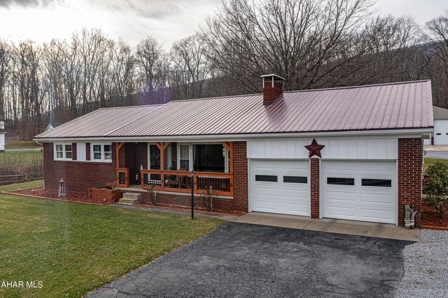 This incredible ranch home is truly above & beyond anything you have seen on the market! Located in a beautiful rural setting in Raystown (near Shy Beaver boat launch), the property spans 1 acre. 3 bedroom, 1 bath, 2 car attached garage, and the most impressive detached Garage Mahal that you have ever seen. 40' x 60' detached 3 car garage, 12'x12' garage doors, and it even has a car lift! 2 Fireplaces (living room and basement). Spacious Basement is nearly finished. Newer roof, Hardwood floors throughout,1st floor laundry, built-in bookshelves in living room with fireplace. Lots of storage and spacious closets. Beautiful outdoor pavilion and covered front & back porch great for entertaining. Central Air & Alternative heat source (Pellet furnace). Enjoy the wildlife, lake life, phenomenal views, and spectacular amenities! This is a rare opportunity to own a beautiful ranch home in Raystown that is beautifully maintained and updated.