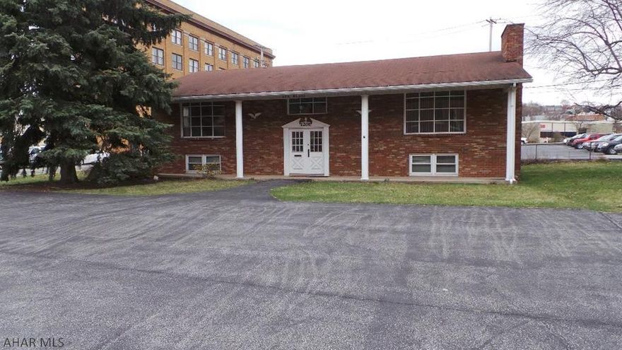 Great office space on corner lot across from Station Medical Center, Railroad Museum and the 12th Street bridge.  Large rooms for offices.  Main level has 4 lg offices, reception area, 2 half and 1 full bath.  Lower level has 4 offices, conference room, reception area and 2 half baths.  Zoning is Neighborhood Business.  Parking in front or back for 18 cars total.  Separate electric each floor.  (Heat is electric.)  Owner will consider leasing all or just one floor.  Put your business here.  Building could be divided for 2 businesses.