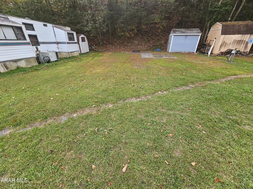 Vacant campsite with shed on 1 lot inside Glendale Yearound.  Water, sewer, and electric on site. Lot is 50x80. Glendale Yearound is a gated community located minutes from Glendale Lake and Prince Gallitzin State Park.