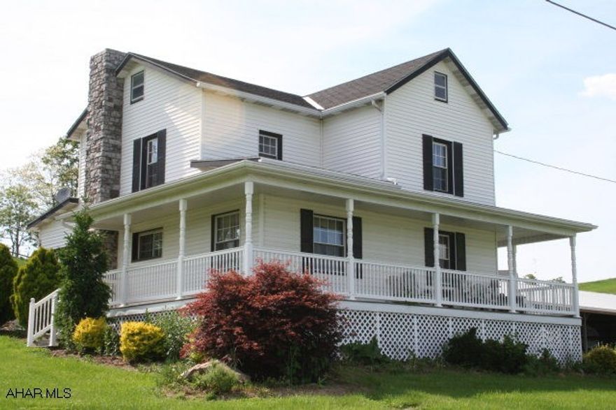 Updated two story with wraparound porch on quiet country road. Location overlooking golf course in progress. Vinyl siding and porch railing, new windows, 200 amp breakers. You have to see it to believe it!  To be connected bo public sewer.