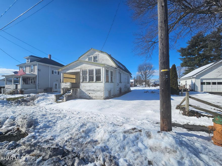 Welcome to this one and a half story home located in the heart of Martinsburg borough. While this home may currently need some tender loving care, its potential is undeniable. With two bedrooms and a full bath on the second floor. 

The first floor features a laundry area, dining room, kitchen, two family rooms, and a sunroom in the front, providing you with plenty of space to entertain and relax. As an added bonus, this property sits on a double lot. 

While this home may require repairs, it presents an incredible opportunity for someone looking for a fixer-upper. With a little bit of work and vision, you can transform this house into your dream home.

Don't miss out  .Schedule a viewing today and start envisioning all the possibilities that this property holds.