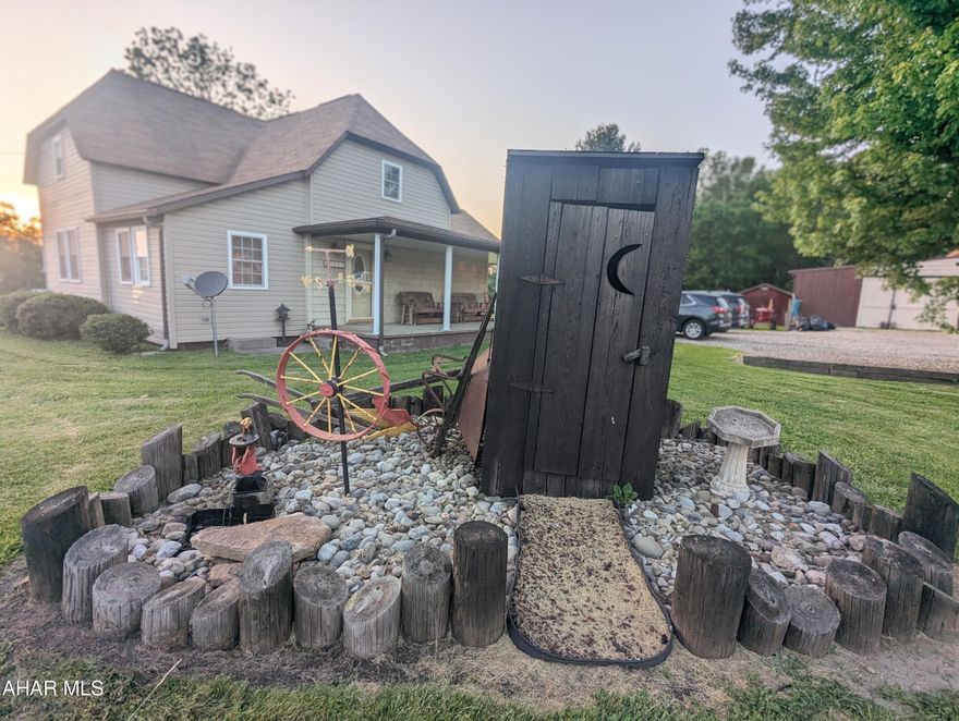 Hobby space galore plus beautifully remodeled 3 bedroom home on 0.6 acres! Large driveway, garage, three sheds - tons of storage for hobbies, decor, or toys. Big country kitchen with plenty of cabinets and counter space. HUGE first-floor bath featuring two sinks, walk-in shower and tub/shower combo, right beside the first-floor laundry! 3 bedrooms and a half bath upstairs. This home is cohesive in it's remodeling with beautiful floors, shiplap accents on walls and ceilings, pretty light fixtures, and unique landscaping. Forced air oil heat / AC and pellet stove. Blacklick Valley SD.