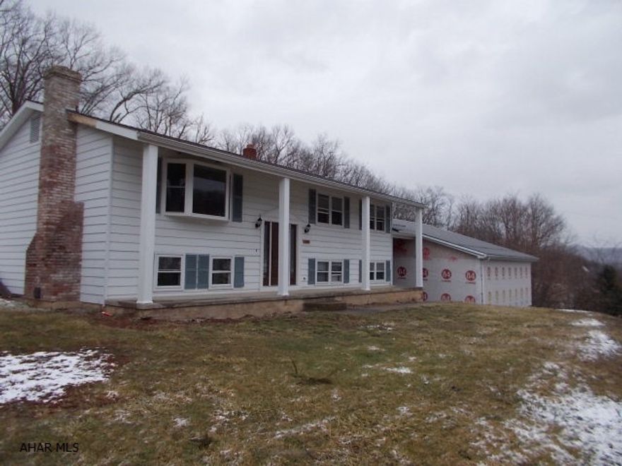 Enjoy the spectacular view. This Bi-Level has 4 bedrooms, eat-in kitchen with stainless steel appliances, oak cabinets, living room, family room and a detached 3 car garage, all situated on 1.98 acres..