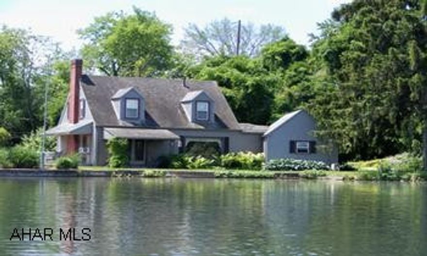 Totally unique.  10 + Acres  Property features two bedroom  house with pne and hardwood floors,one full bath, two half baths,  large three story building formerly a mill, detached garage plus other sheds. Fish from your own yard.  Waterfront unique. Right on the breast of the dam. Plenty of room to spread out on this 10+ acres.  Endless possibilities.  Fish from your own yard! Totally unique with the large three story building (was formerly a mill). Detached one car garage, plus other sheds.  Waterfront property is truely unique.