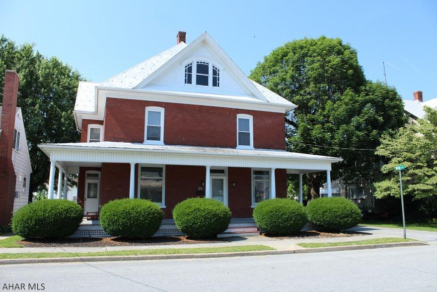 Well maintained 2 story brick home with wrap around porch. Inviting formal entry / sitting room. Formal dinning and eat in kitchen.  Main floor   bath. Spacious 4 bedrooms with recently updated full bath on 2nd floor. Natural hardwood floors and trim throughout with wood pocket doors is an added bonus to this great home. Outside offers nice landscaping with flat backyard, off street parking and two car detached garage. No matter if you are looking for a first home to start a family or need to upsize for your growing family this is the perfect home.