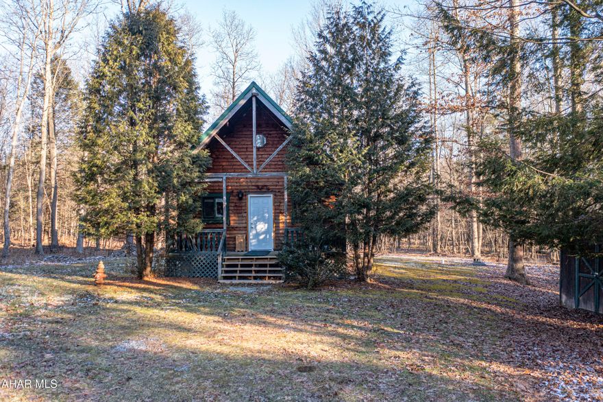 Escape to this cozy 2-bedroom log cabin, nestled on 6 private acres, offering peace, tranquility, and endless outdoor opportunities. Ideal for hunting, hiking, or simply enjoying the beauty of nature, this property is a true retreat.

The home features a spacious, open concept living area with rustic charm, highlighted by wood finishes and a welcoming atmosphere. The main level includes two bedrooms, while the full loft offers additional flexible space - perfect for a third bedroom, office, or recreational area.

The unfinished basement with a walk-out door offers great potential to add additional living space or storage.

Outside, you'll find a large shed for extra storage.

Located just a short drive from Prince Gallitzin State Park, enjoy easy access to boating, fishing, and camping, making this home a perfect getaway for outdoor enthusiasts. Whether you're seeking a year-round home or a weekend retreat, this property is a rare find!