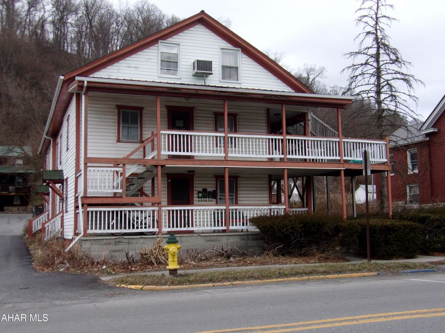 This multi-level, multi-unit apartment building has 7 units, 2 of which are occupied by the owner. Most utilities have NOT been separated. Property has street or alley access with 5 parking spaces in back.  There is a 24x24 garage, currently used for storage, which could be rented, cars or boat, or possibly made into storage units.  Trimming overgrown landscaping would reveal more side and backyard outdoor space. Close to all amenities. This property needs some work, but the potential is there for a nicely profitable enterprise.  For comparative purposes only.