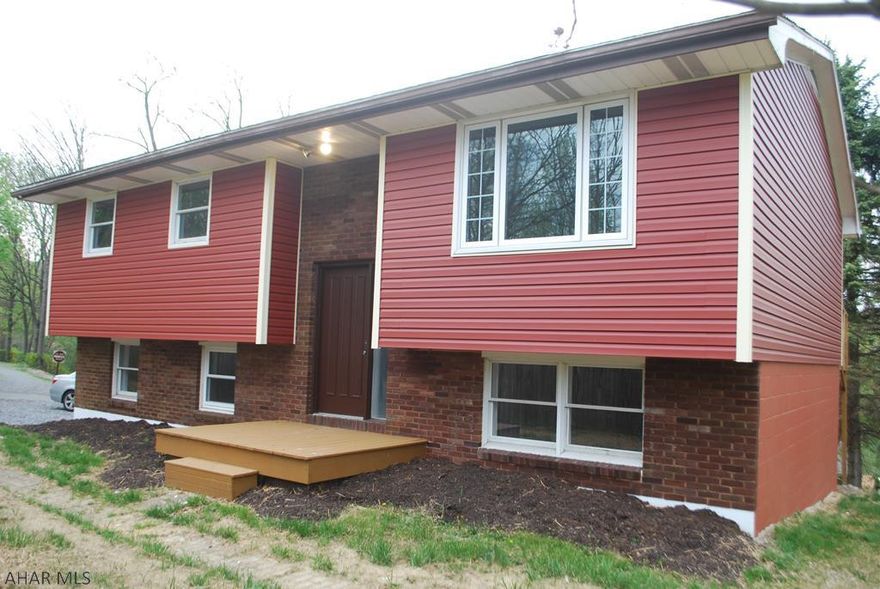 PRIVATE & SECLUDED 3 bd. 1.5 ba split level home!  Many updates thoughout!  New floors, fresh paint, newer vinyl siding, spruced up kitchen and bath!  Don't miss!