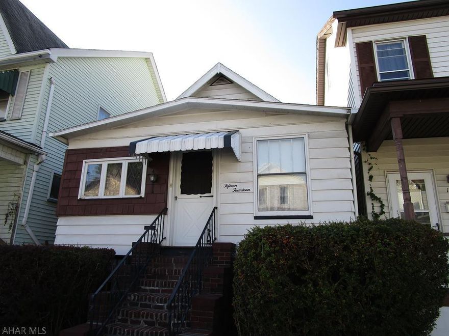 Great starter home or start your portfolio of investment properties!.............SWEET 2 -3 Bedrooms, 1 Bath.  Kitchen is spacious and has eat in area and lots of cabinets - in great shape.  Just off the kitchen is a "bonus room" that could be an office/den/playroom or whatever you choose.  There is a large bedroom on the main floor and a full bath as well.  Upstairs is open for creativity - great space for that teenager!!!