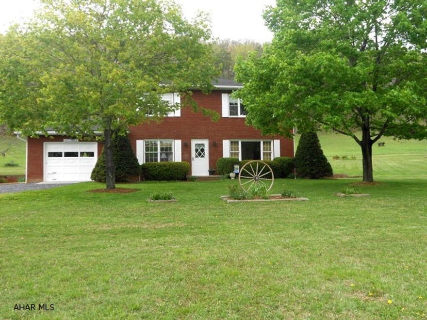 Perfectly charming brick colonial on 10.62 acres. So many things to offer. Outside living includes spring fed 8 foot deep pond. Grape arbors, blueberries, apple tree and a garden area. Wooded behind for the nature lover, lots of wild life and birds to enjoy. Inside is freshly painted and inviting with 4 bedrooms, 2 full baths and lovely views from every window. Brick fireplace with wood stove insert in Family Room. Brand new Furnace installed in 2010 and completely new Septic System installed this year! Look no further !