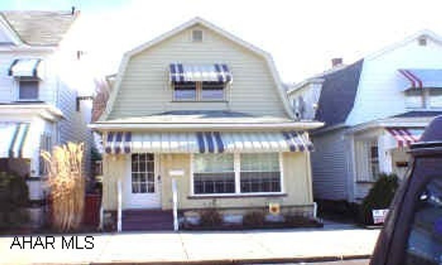 2 story, 3 bdrm, 2.5 bath with new furnace, central air, enclosed front and rear porches, fenced yard, and 1 car detached garage. Possession on or after 3/31/06.