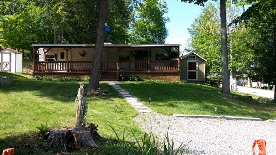 Beautiful 2004 Breckinridge park model 40' camper on a corner lot in Glendale Yearound. This camper looks like new. It has two bedroom. Spacious covered deck attached. There is also a small shed.