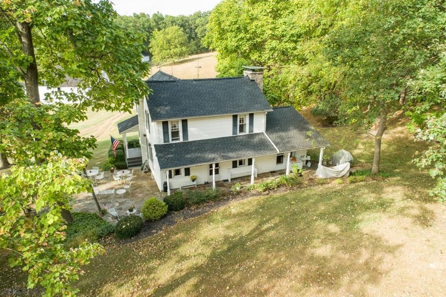 Drive along the wooded lane, see the large 2 acre pond on the left. Lower farm houses the caretaker and has many outbuildings and a new Morton shed. Further up the lane is the upper farm with a picturesque setting ,overlooking a 2nd pond. All furnishings and equipment are included  with sale price. White house has many updates. White outbuildings and fencing make for a breathtaking setting. Barn is suitable for horses. Farm previously was a turnkey hay farm with appx 365 acres. Abundant with wildlife, trees, wildflowers, trails etc. Close to Rt 70 and easy drive to amenities. Call for information. Enjoy the photos and video!