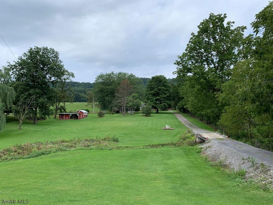 Mobile home on a 2.5 acre lot situated adjacent to Warriors Mark Run with picturesque country views. Located close to world class trout fishing streams and within 25 minutes to Penn State University and 50 minutes to Raystown Lake. A perfect building lot for your dream home.