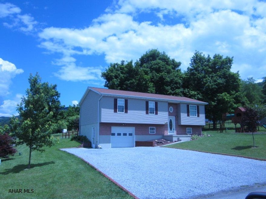 Immaculate home on large fenced  treed lot. Newly finished family room with ceramic floor and pellet stove. Master bedroom has private bath. All appliances stay. Great yard with back deck. Walk to the football games!Oversized garage with lots of storage.