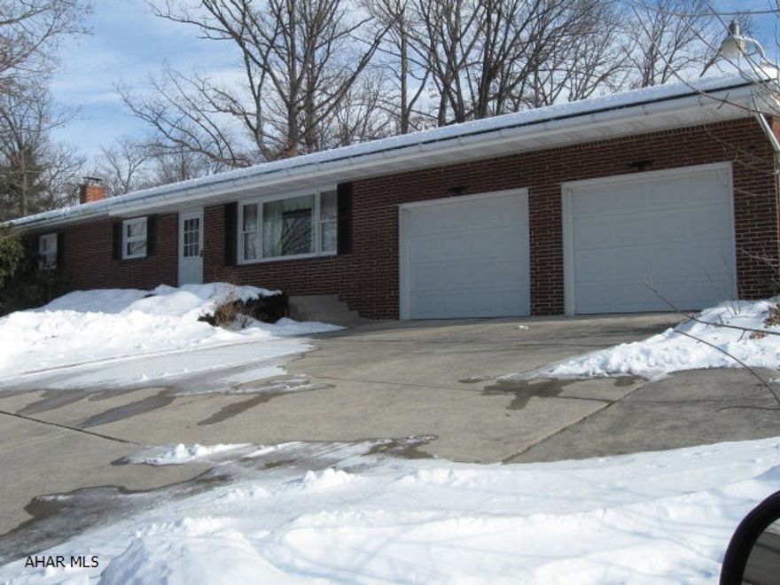 Hollidaysburg Schools. Nice low traffic area. Solid Brick Ranch. Large Level Lot has side alley and measures 74.41 x 129 x 209.8 x 187.  Huge finished basement has propane fireplace (can be reconverted to wood). Waterproofed and new French Drain in 2009.  2+ car garage with workshop and storage. Additional parking. Central Air.  Owner relocating.