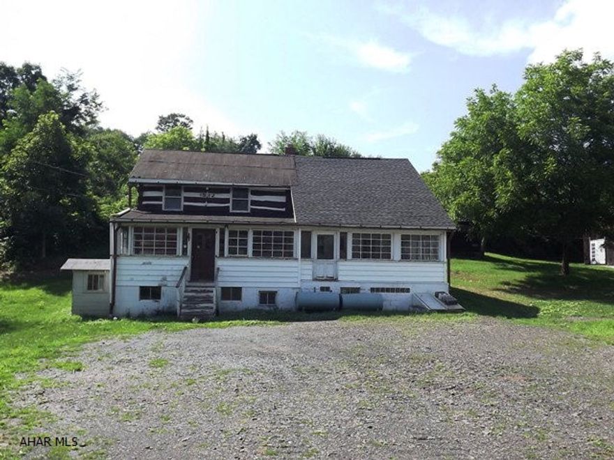 Secluded 1812 log with addition on almost 28 acres, located near the borough of Schellsburg (founded 1806)!  Possible 3 bedroom, 1.5 bath home  with enclosed porches and walk-out basement.  This truly unique find offers beautiful acreage with hundreds of nut and fruit trees!  Barn and outbuildings, mountain views, 2016 sand mound, black walnut paneling, spacious rooms. Survey available. Easy access to I-99, Pa Turnpike.