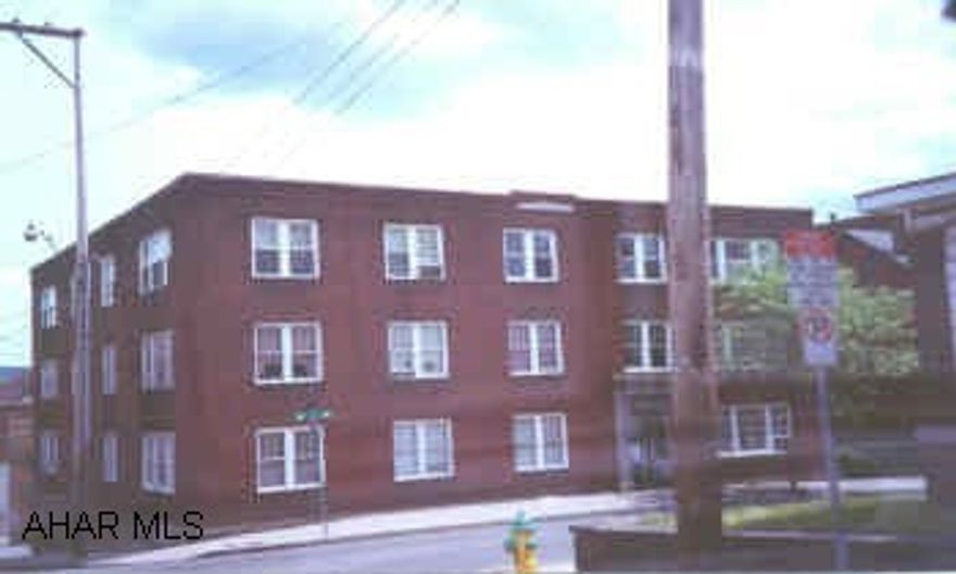 9 unit brick apartment building.  Large apartments.Seperate electric. Newer roof.  Large units.